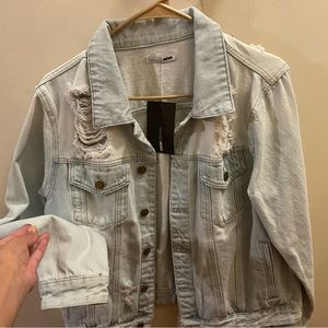 Brand new distressed jean jacket with tags on still